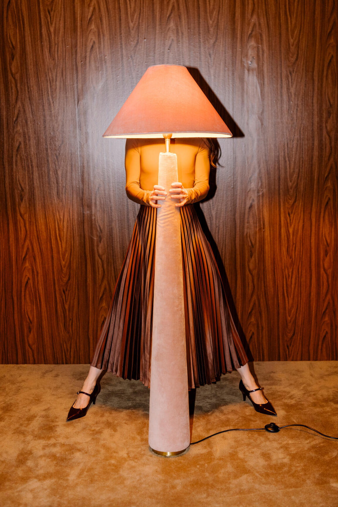 The Expansion Room Lady holding standing lamp light